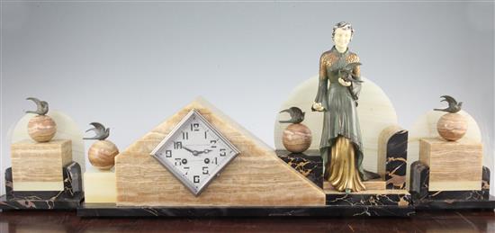 A French Art Deco onyx, marble and patinated metal clock garniture, 13in., with key and pendulum